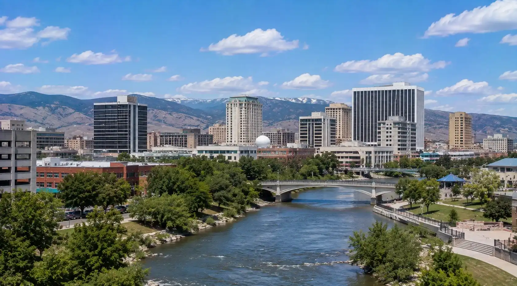 Downtown Reno and Truckee River with the Sierra Nevada setting
